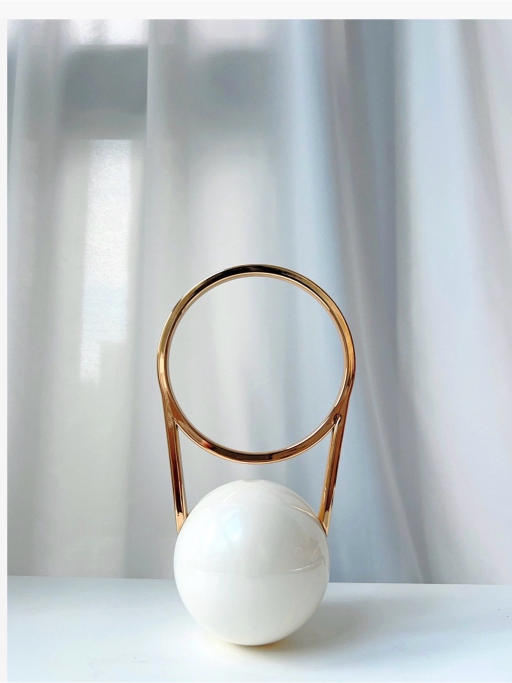 A Classy Chic Boutique Gold-Accented White Sphere Handbag